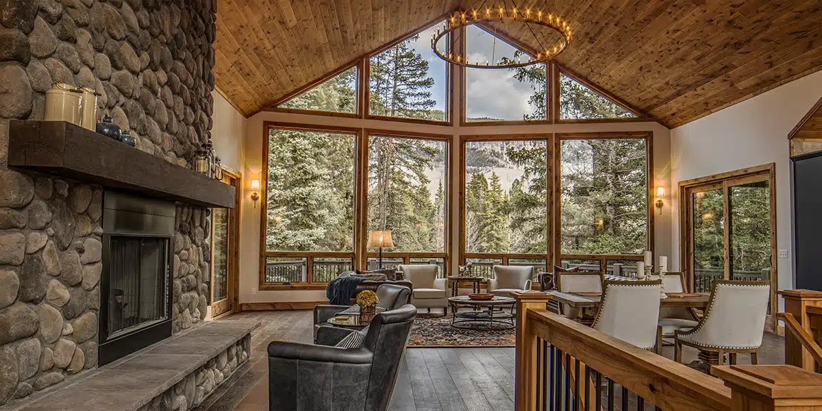 living room with large windows showing mountain views